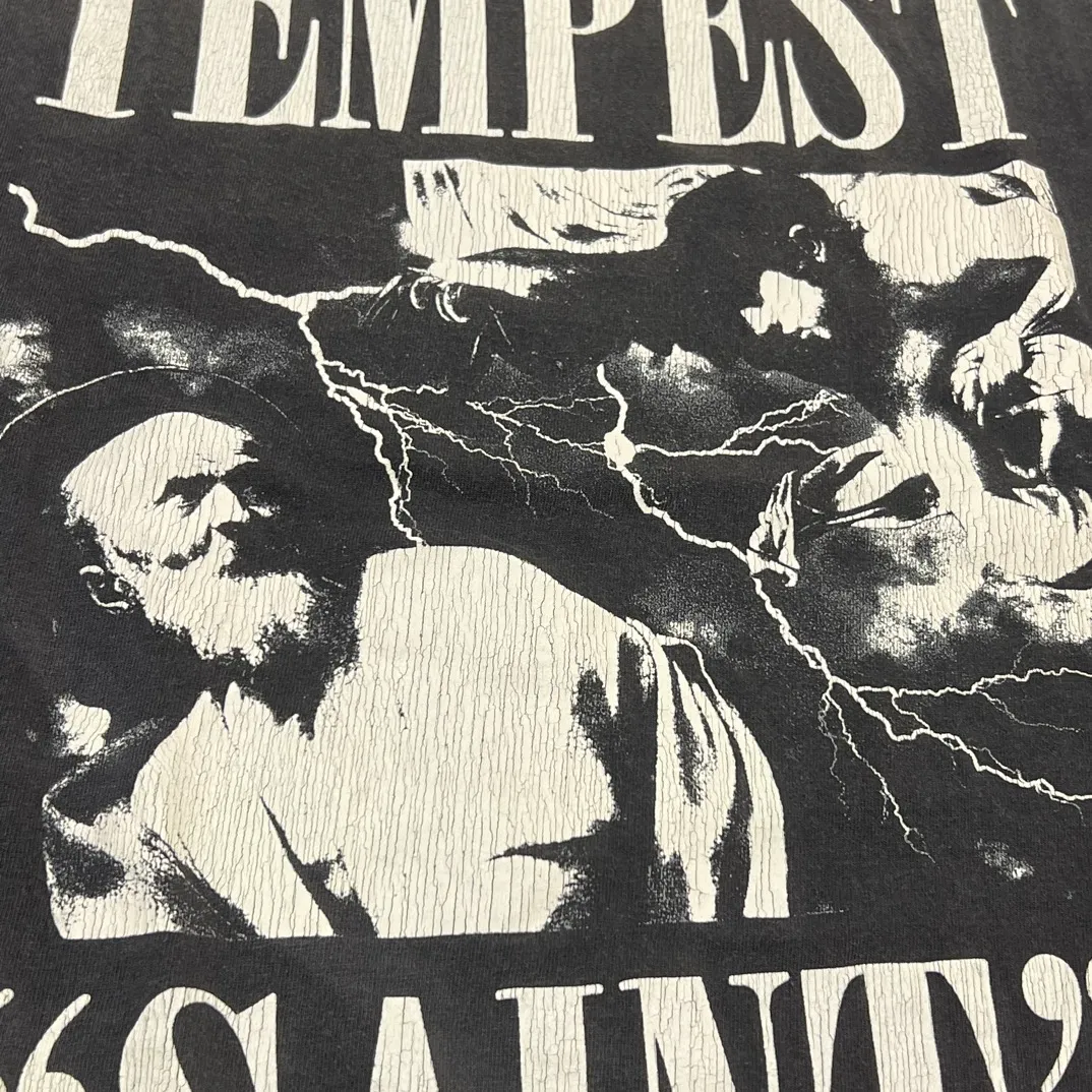 SAINT Mxxxxxx LS TEE/TEMPEST/BLK 'TEMPEST SAINT' Storm Religious Saints Cracked Retro Vulcanized Heavy Wash Long Sleeves Washed Black S-XL Assute Dyeing Multi-bit Horse Fading Craftsmanship Grinding and Hanging Holes Full of Old Feeling Top Printing Craftsmanship Purchasing Level